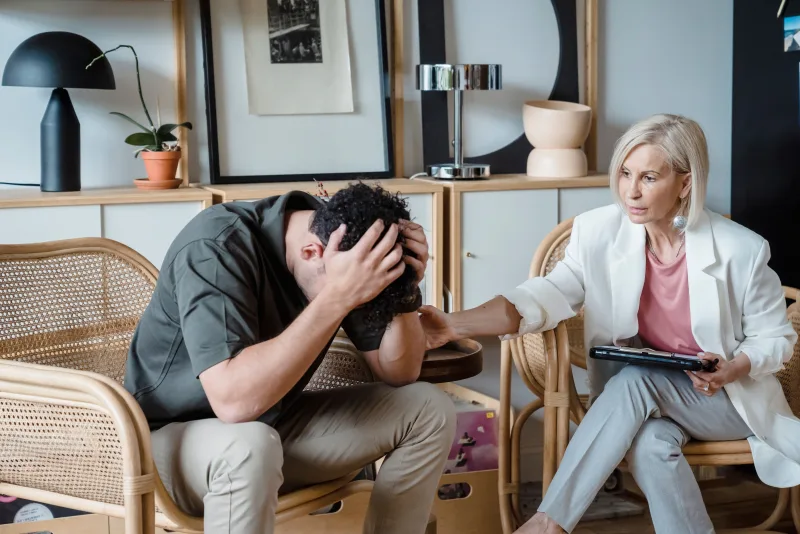 Compassionate trauma therapy in Tampa with therapist offering emotional support